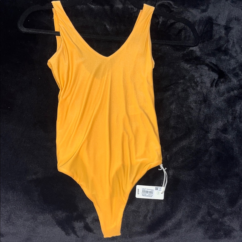 bright orange bodysuit